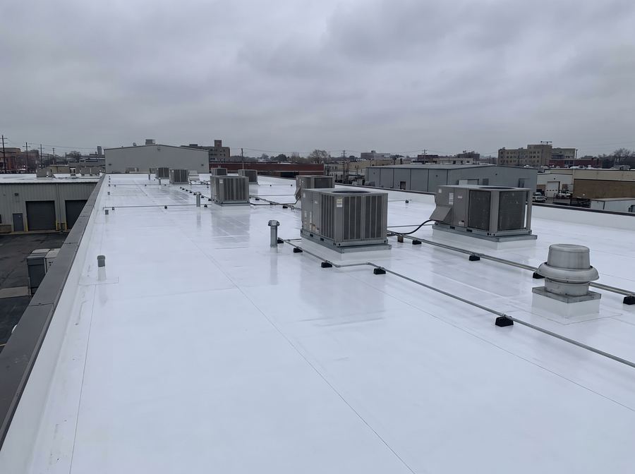Flat commercial roof with TPO membrane installation