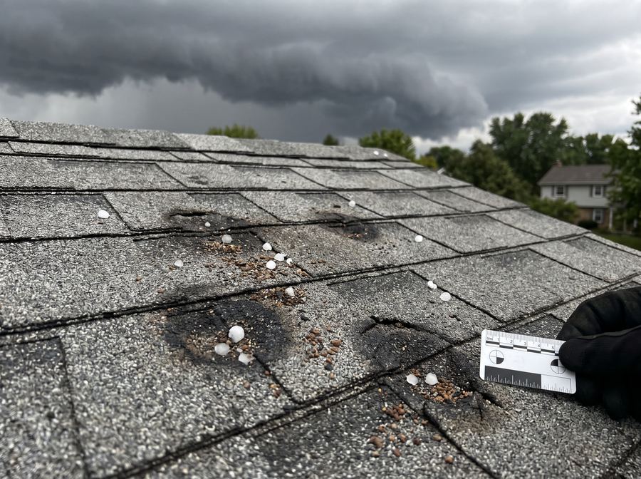 Hail damage on asphalt shingles after a Central Illinois storm